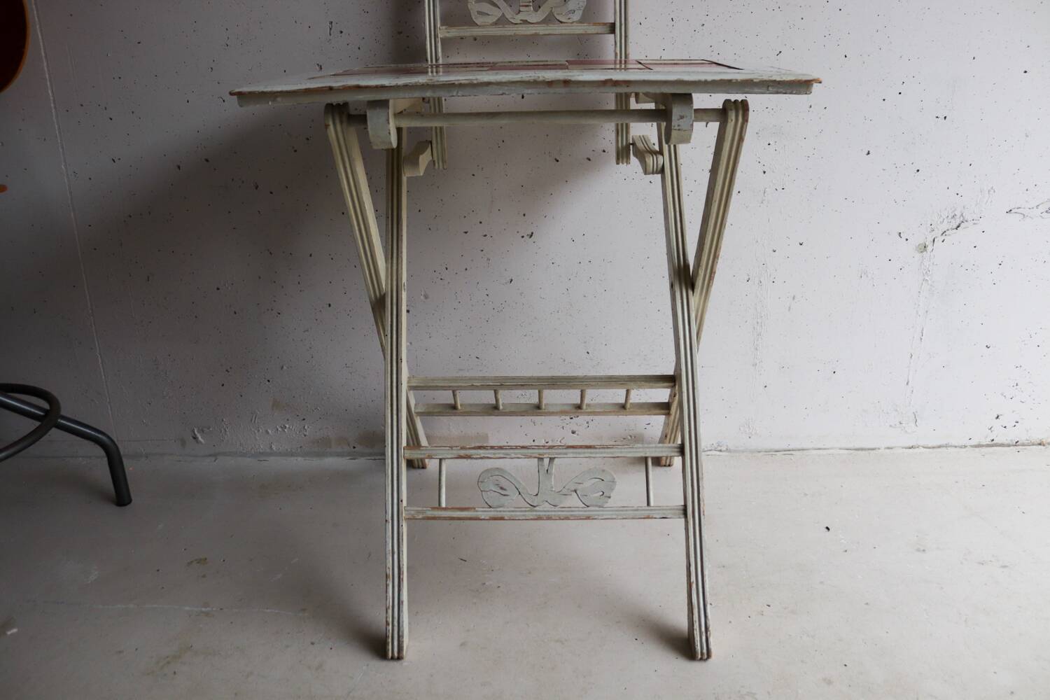 Small antique folding wooden dressing table with tiles and a mercury mirror.
