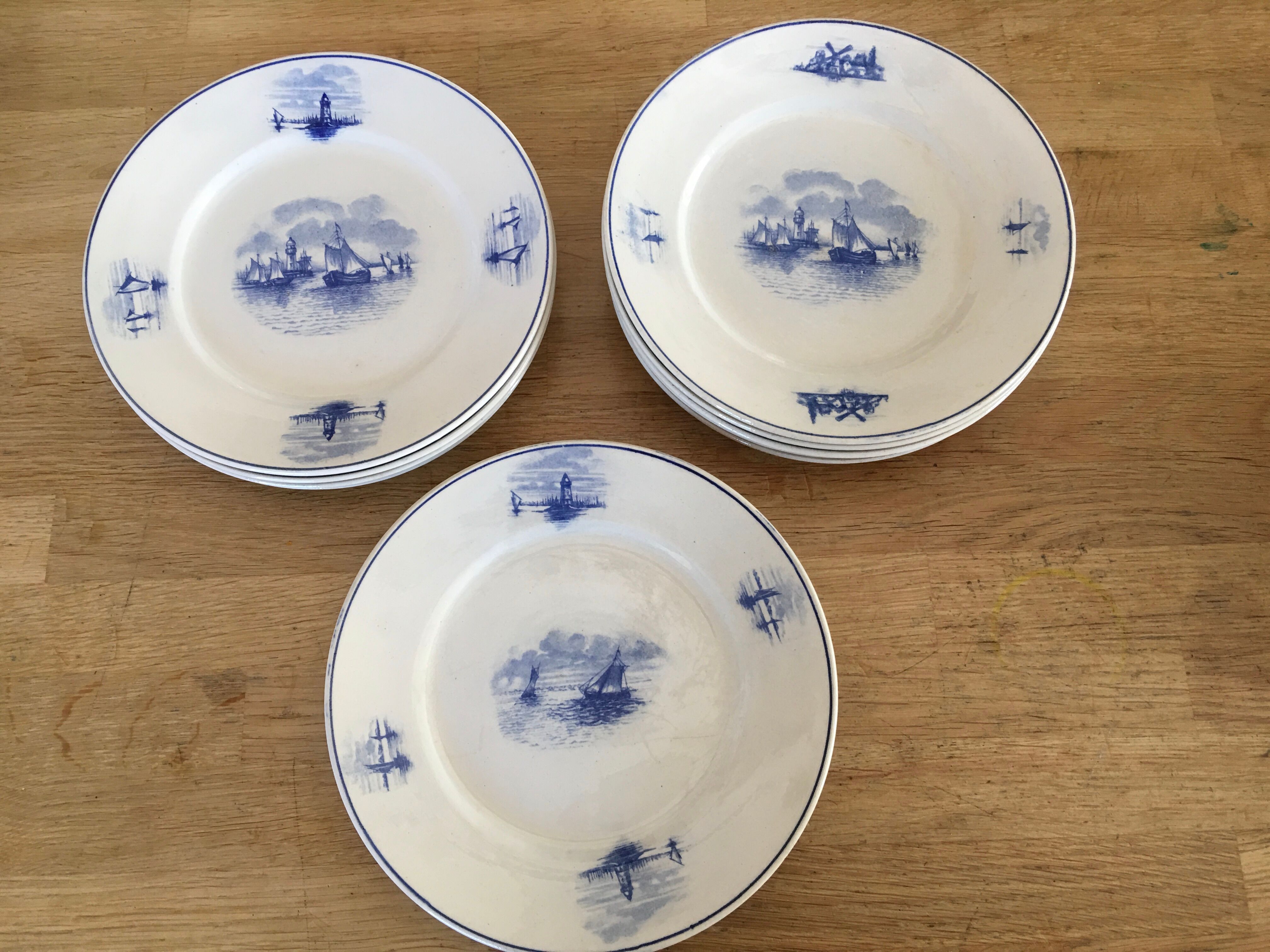 Series of 11 flat plates, Dutch earthenware, early XX