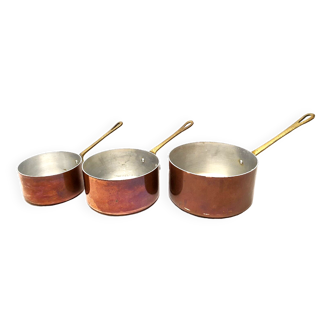 Series of 3 old copper saucepans with vintage decorative brass handles