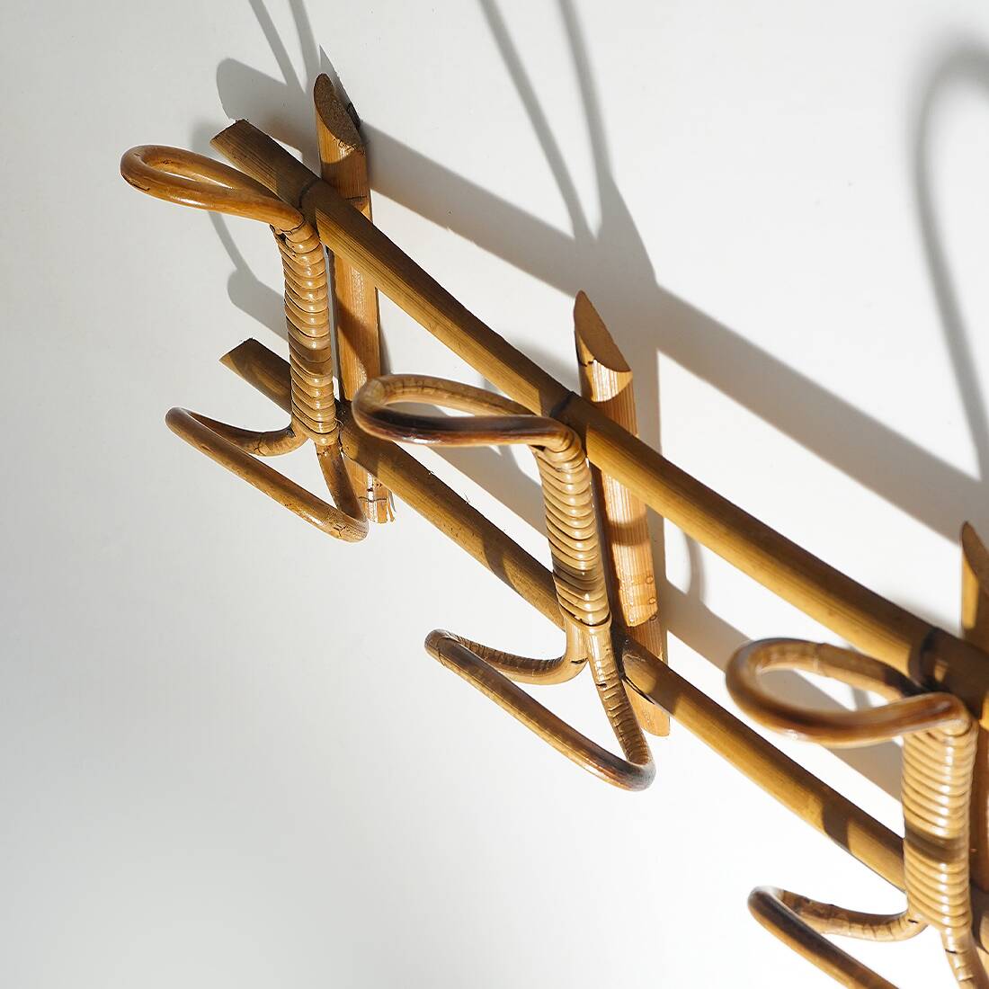 Wall coat rack in rattan and woven wicker, 1960s.