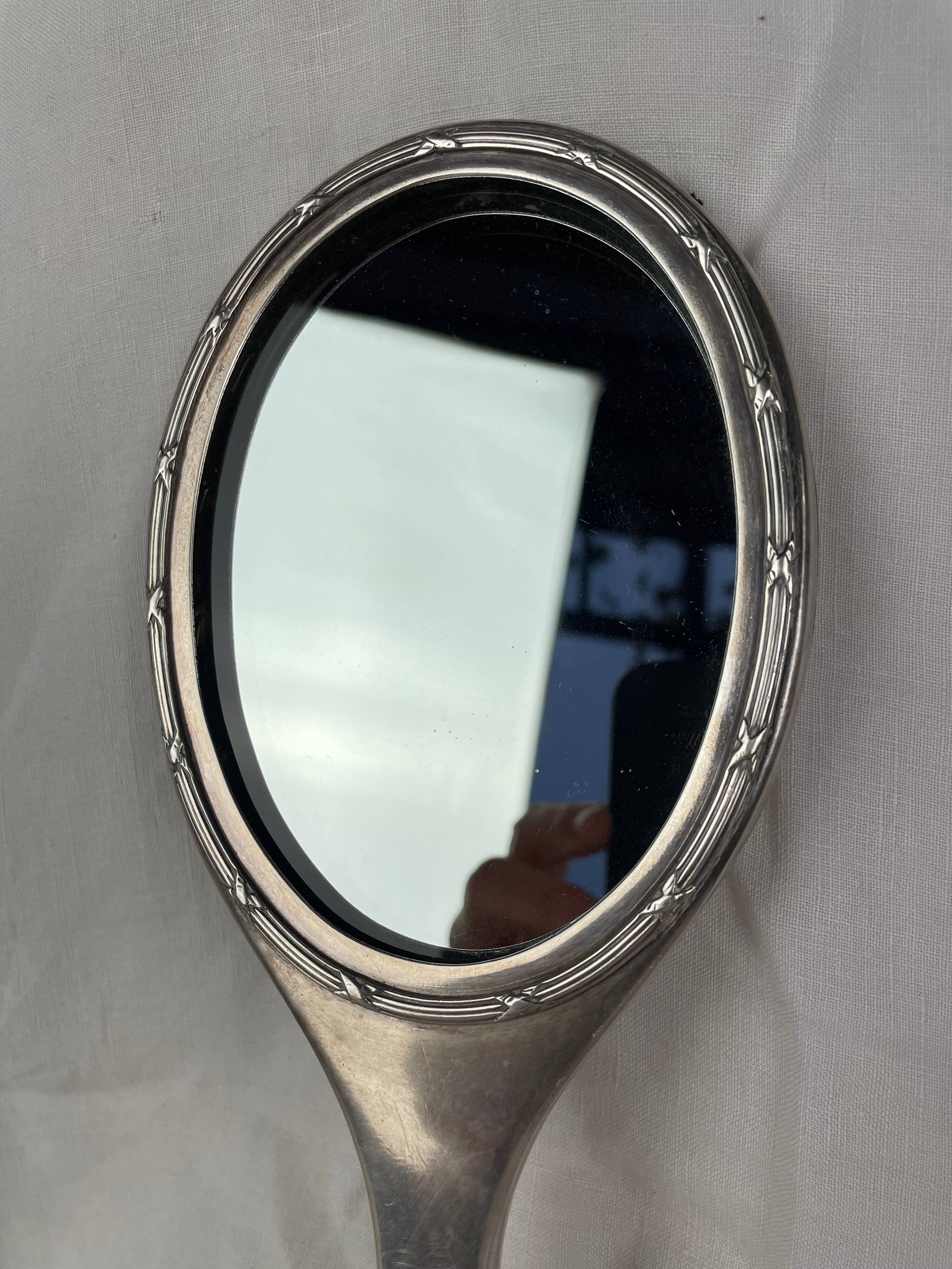 Silver metal hand mirror