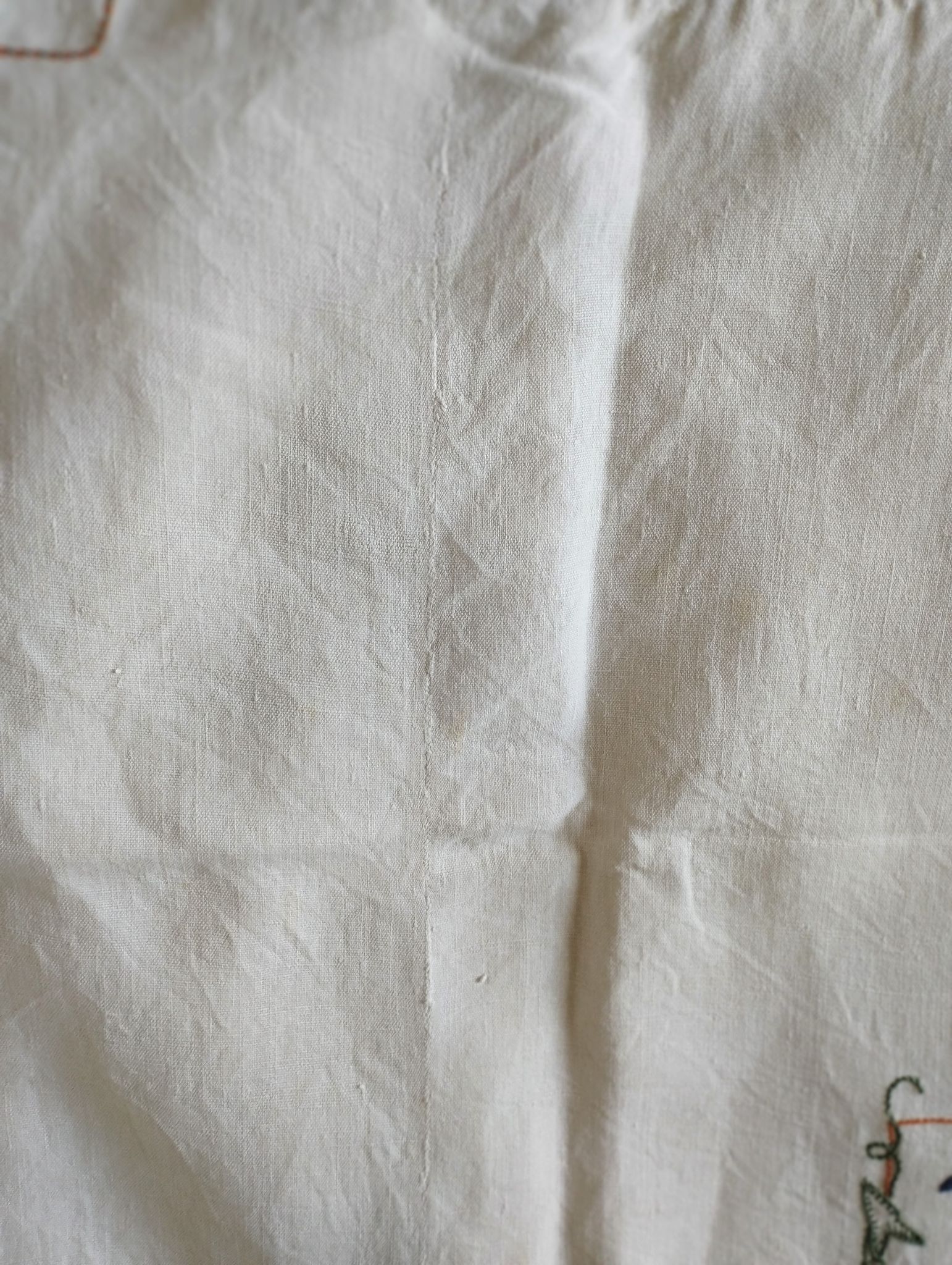 Antique linen tablecloth embroidered with flowers