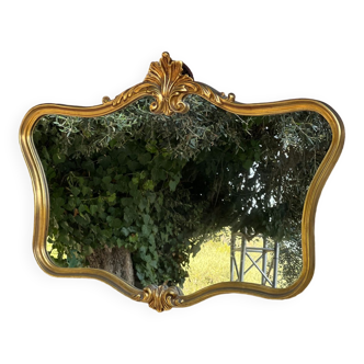 Mirror in gilded wood carved and molded