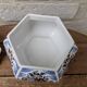 Decorative pot jar with a lid featuring a blue floral pattern and gilding.