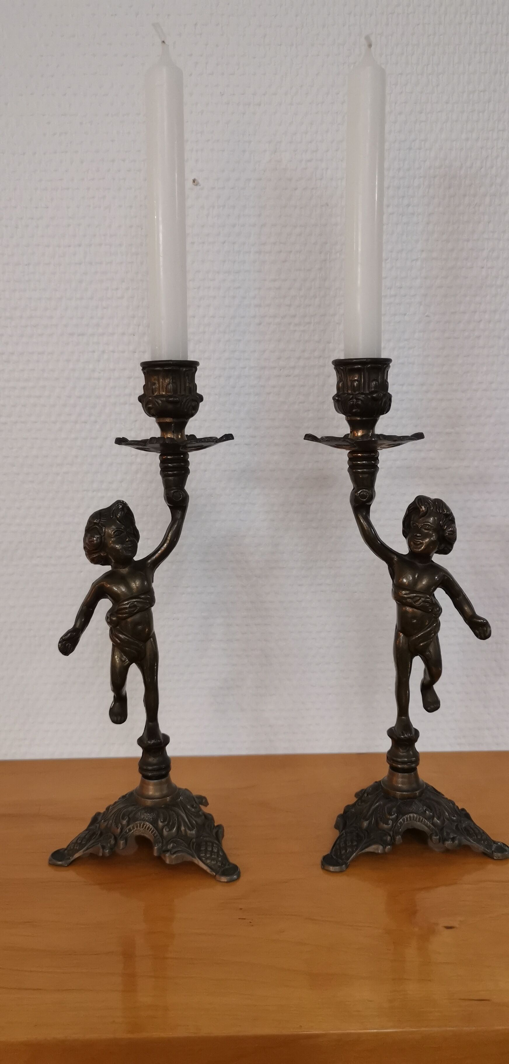 Pair of antique candlesticks in bronze and brass