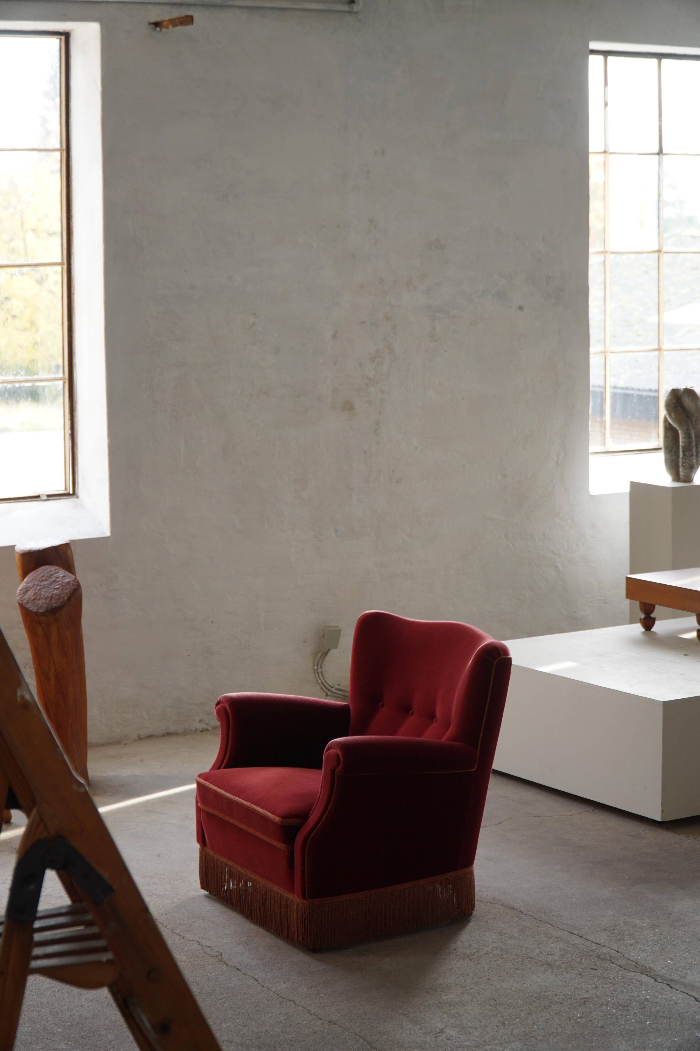 Pair of modern Danish lounge chairs, cherry red velvet, 1950s.