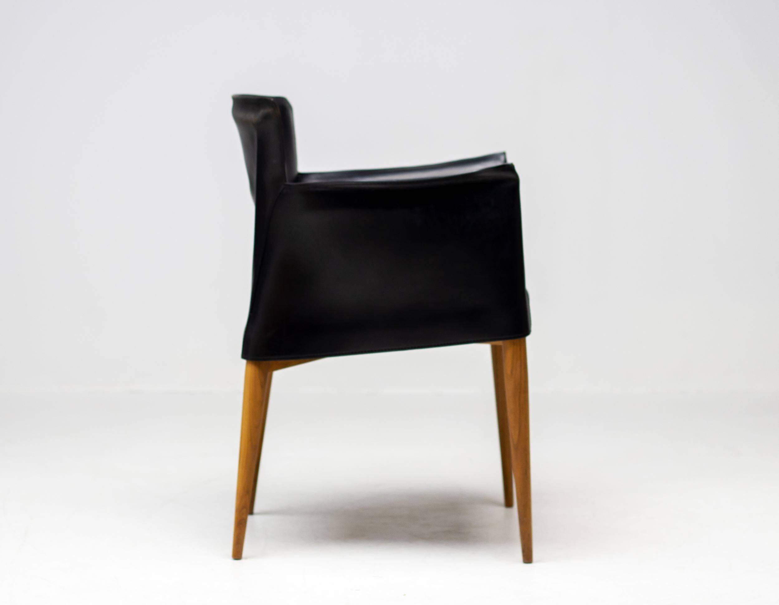 Set of four Vela leather armchairs by Carlo Bartoli - Italian modern elegance.