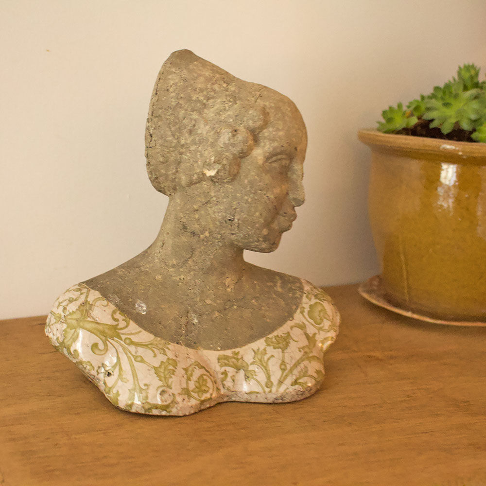 Woman bust in stone and enamel