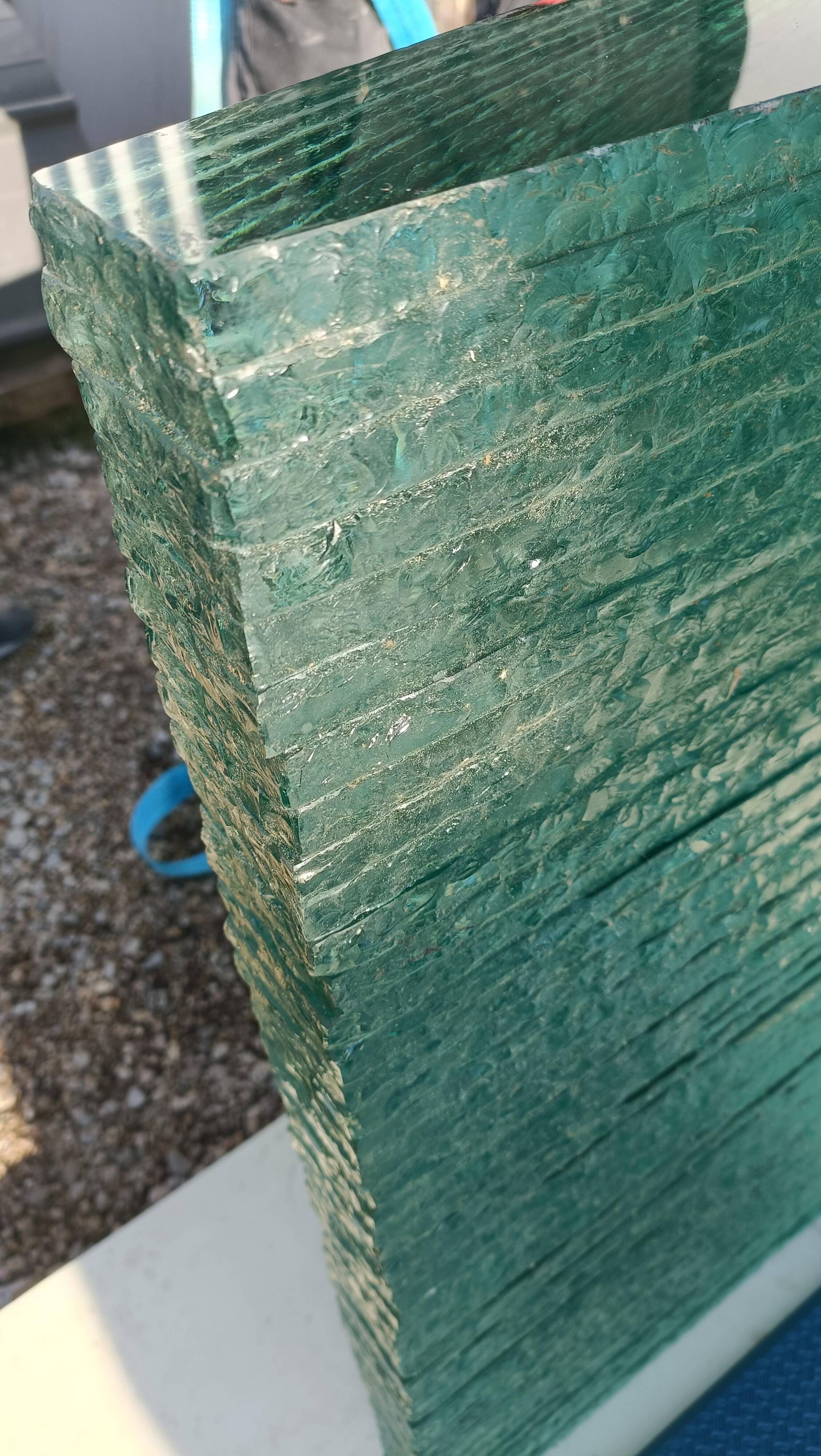 Solid glass desk with a half-moon top.