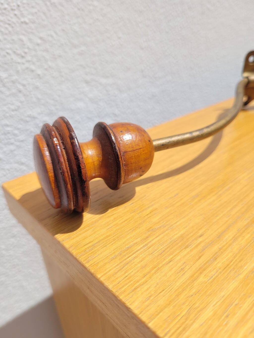 Pair of antique wooden and metal coat hooks