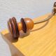 Pair of antique wooden and metal coat hooks