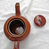 Brown ceramic teapot and milk jugs