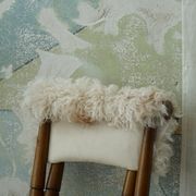 Folding stool, reupholstered in long-haired sheepskin, mid-century modern style, 1950s.