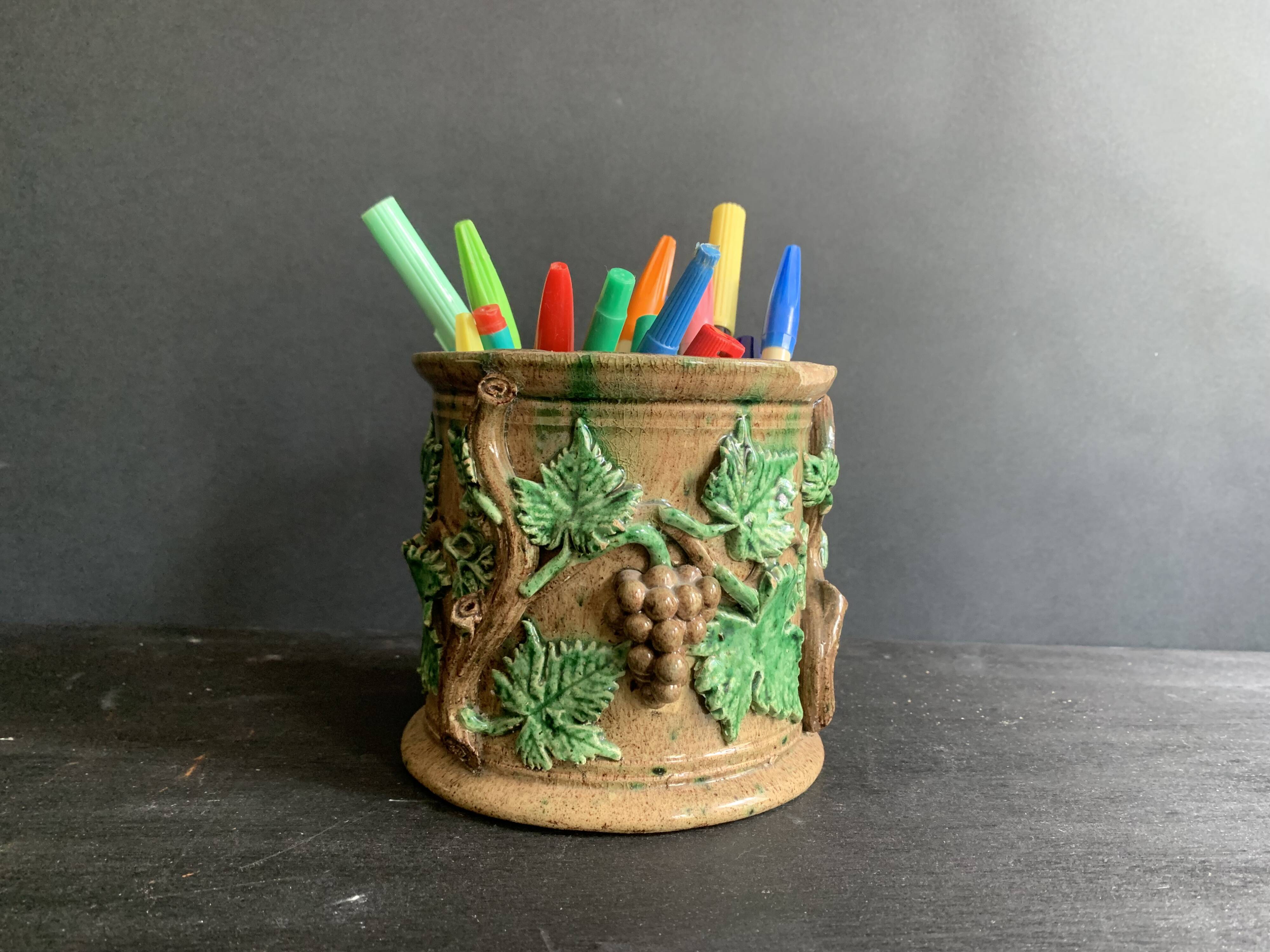 Large 19th century slip pot with vine decoration