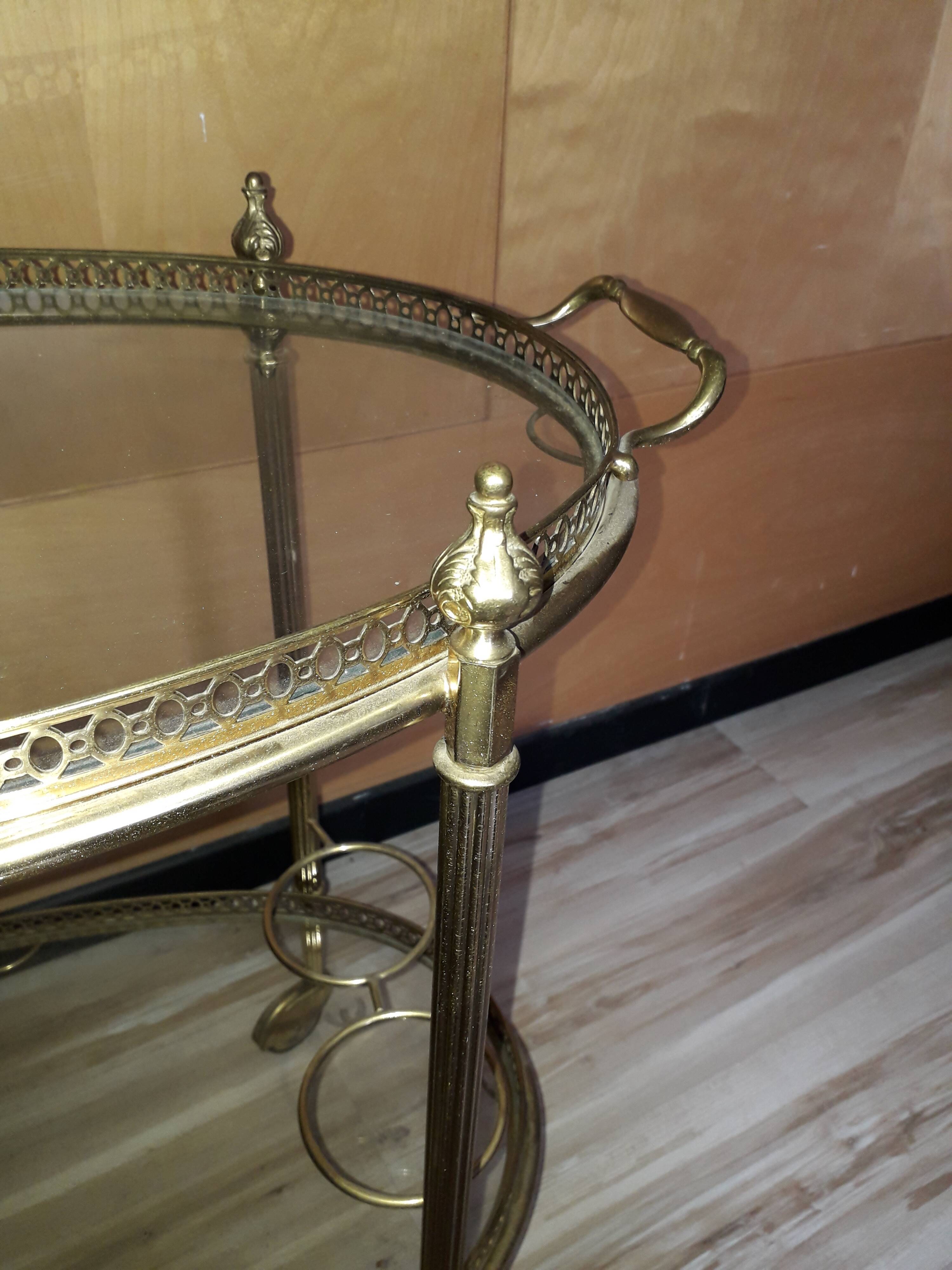 Dessert on brass wheels and glass door bottles year 60