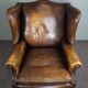 Fauteuil en cuir de vachette patiné