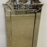 Venetian mirror with floral decoration pediment