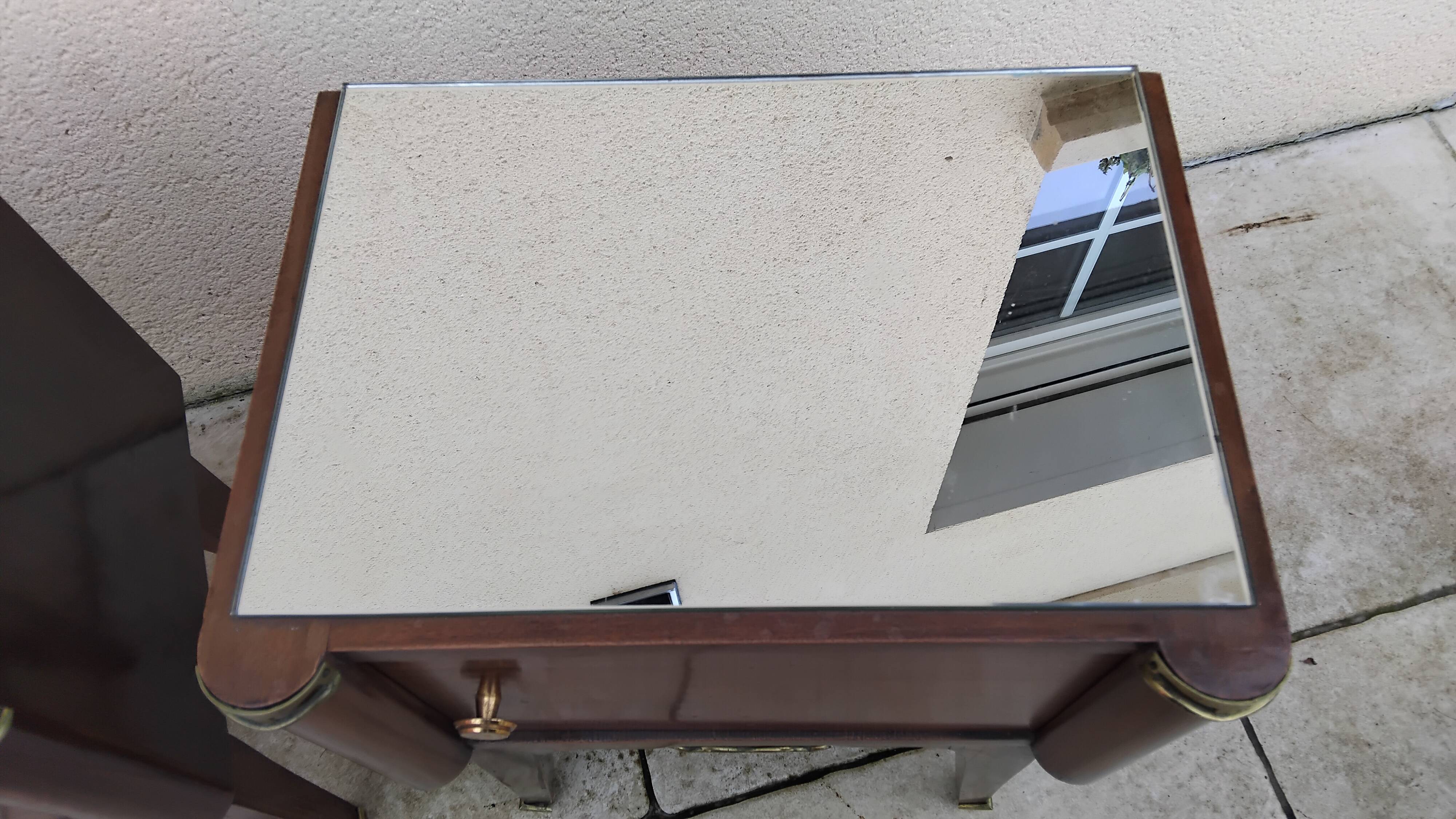 Vintage bedside table with a mirrored top, Art Deco style.