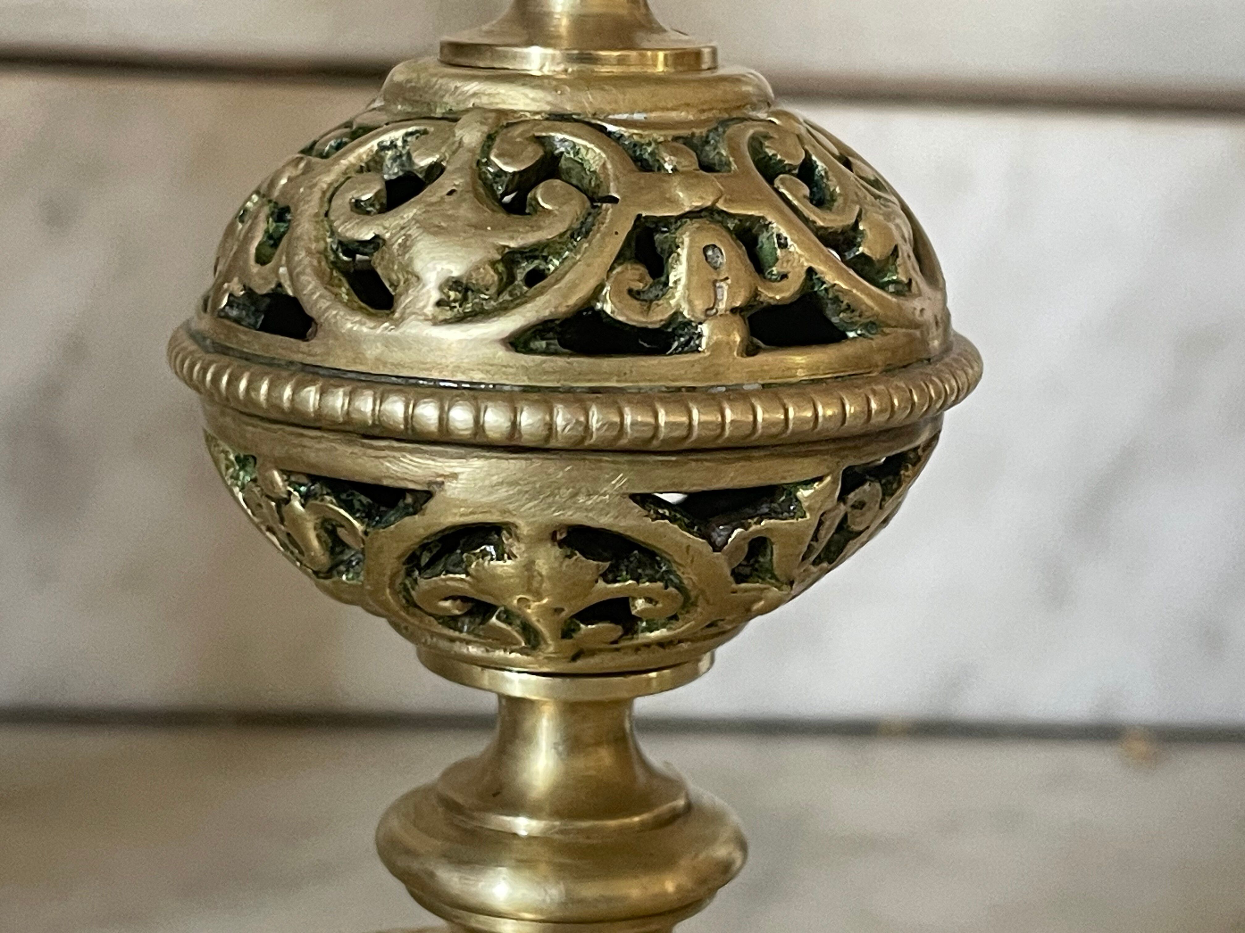pair of openwork gilded brass candlesticks from the 19th century