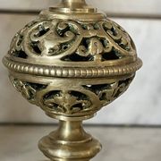pair of openwork gilded brass candlesticks from the 19th century