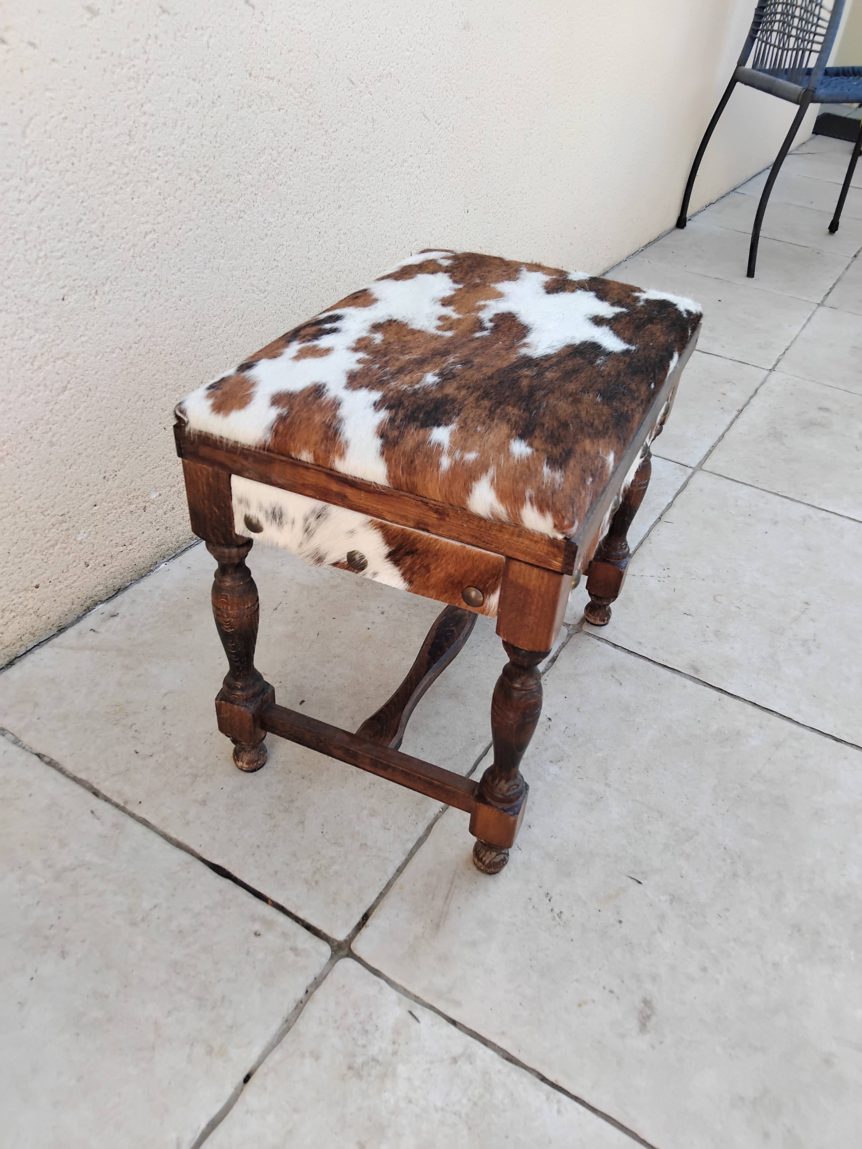 Vintage cowhide trunk stool