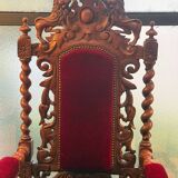 Pair of Louis XIII style armchairs in carved wood