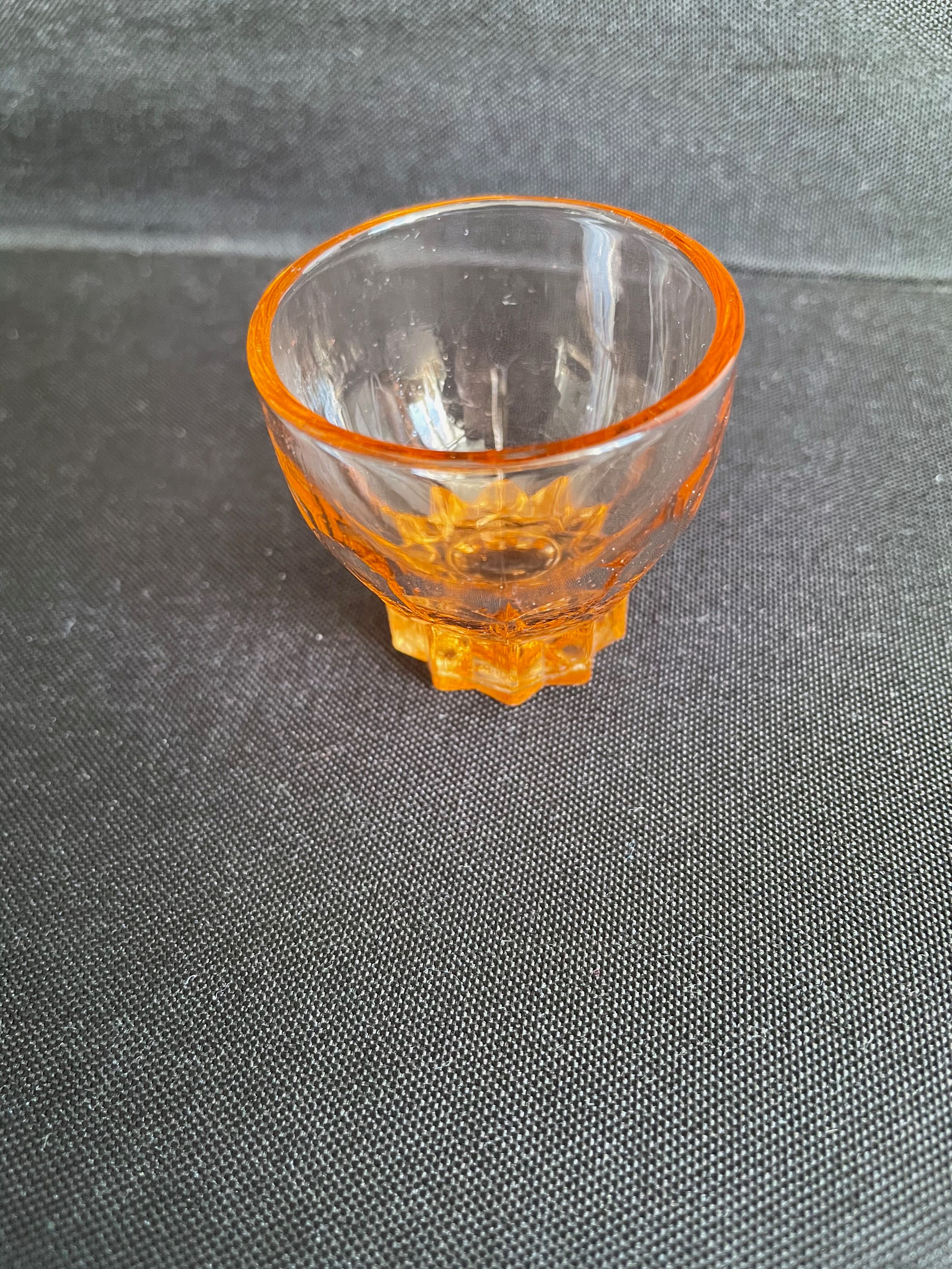 Liquor service in pink moulded glass