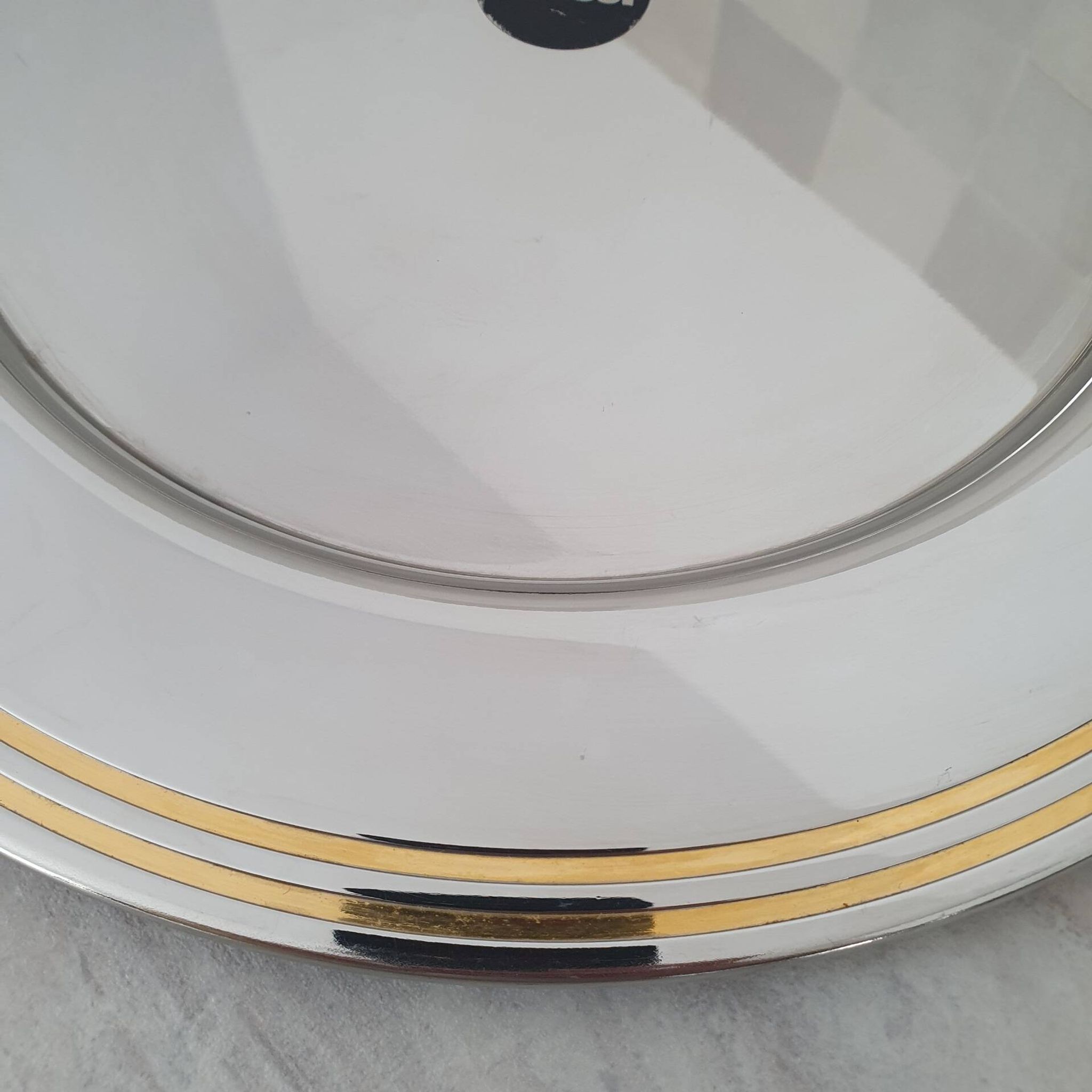 Alessi Ettore Sottsass / Serving plate in stainless steel 18/10 and gold NG5100