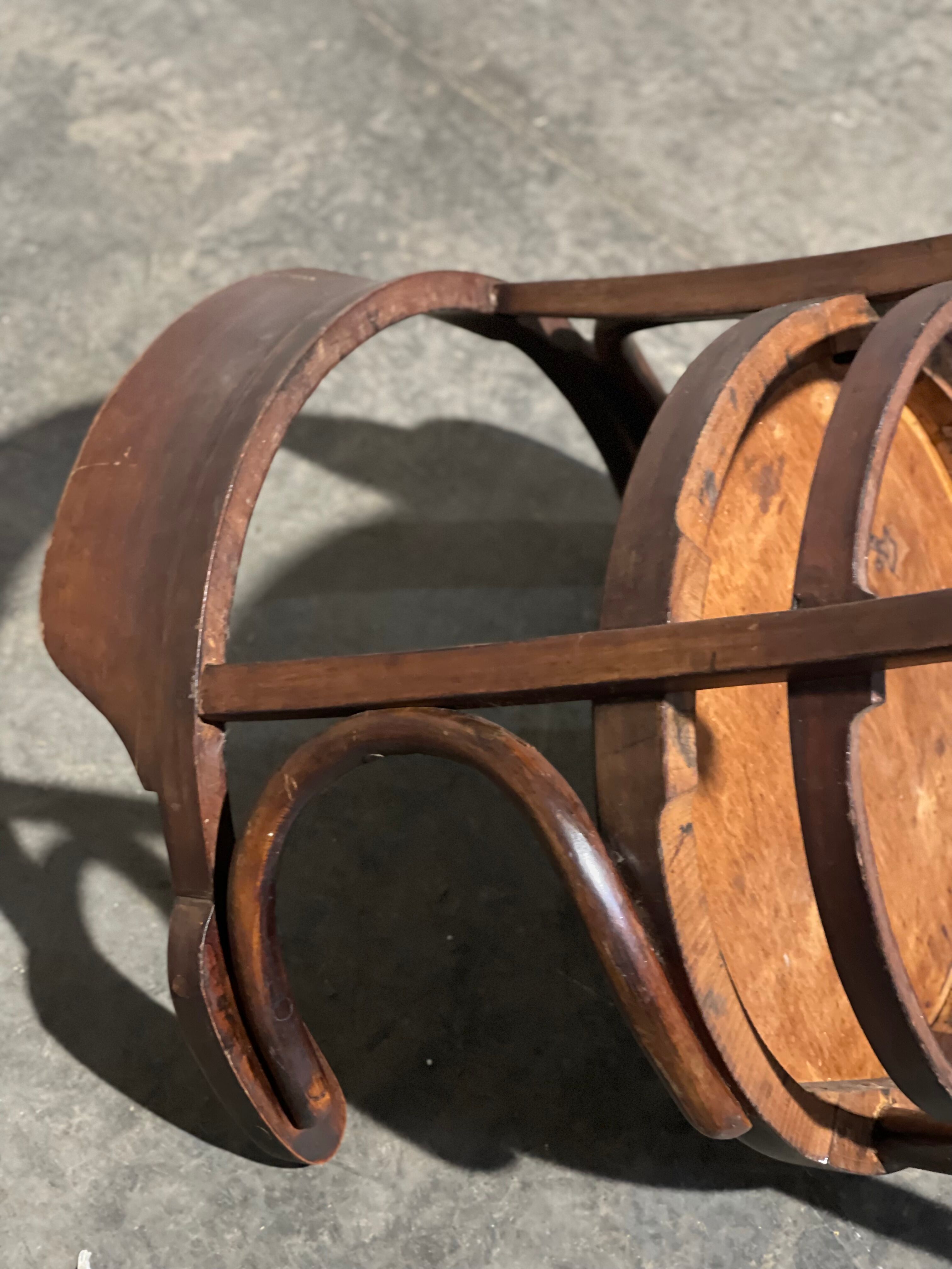 Curved wooden armchair