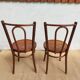 pair of bistro chairs, curved wood and pattern on the seat