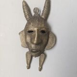 Handcrafted bronze wall mask, Sénoufo African art.