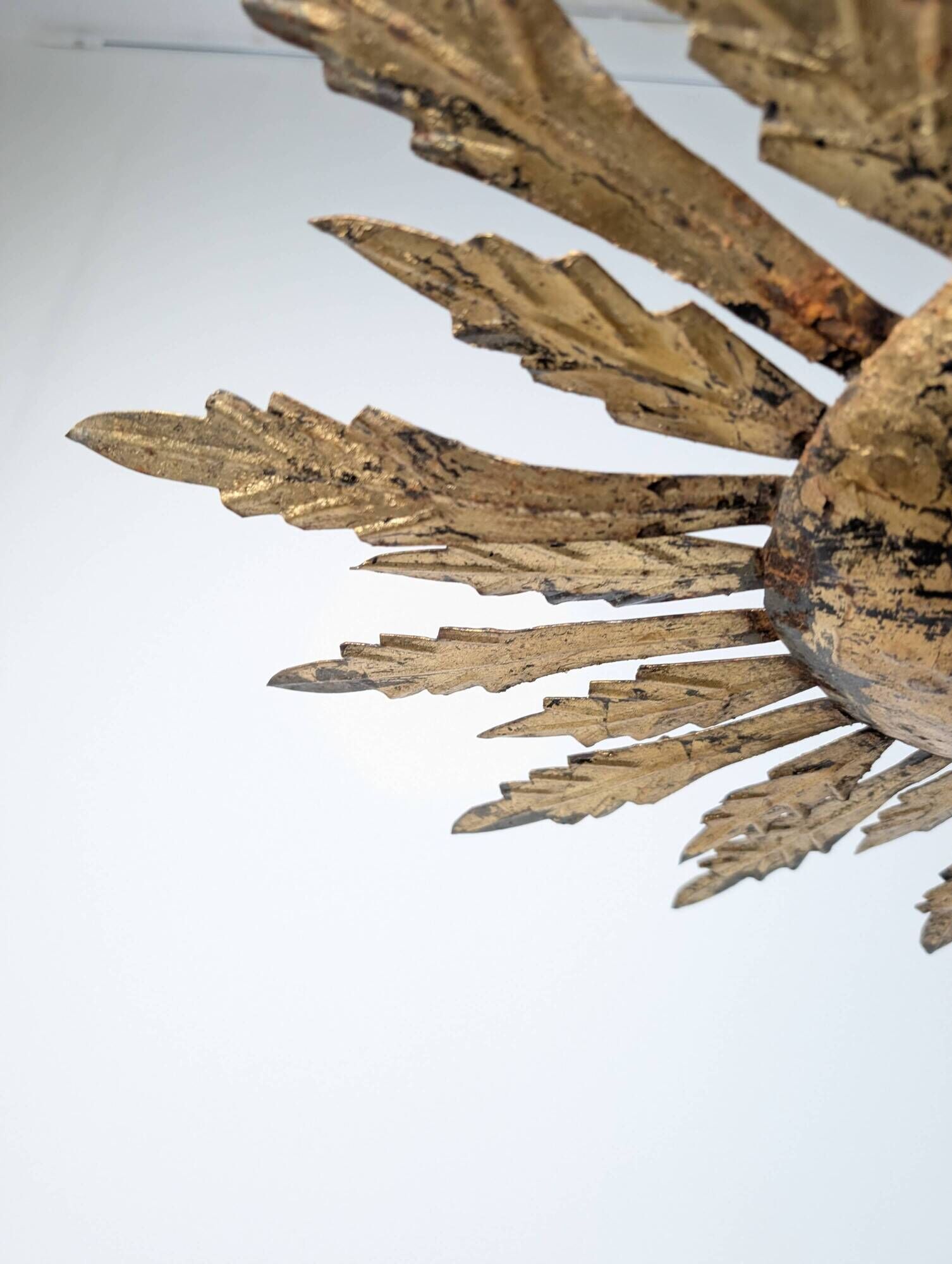 Mid-century sun ceiling lamp in gilded metal with leaf rays, 1950s