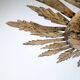Mid-century sun ceiling lamp in gilded metal with leaf rays, 1950s