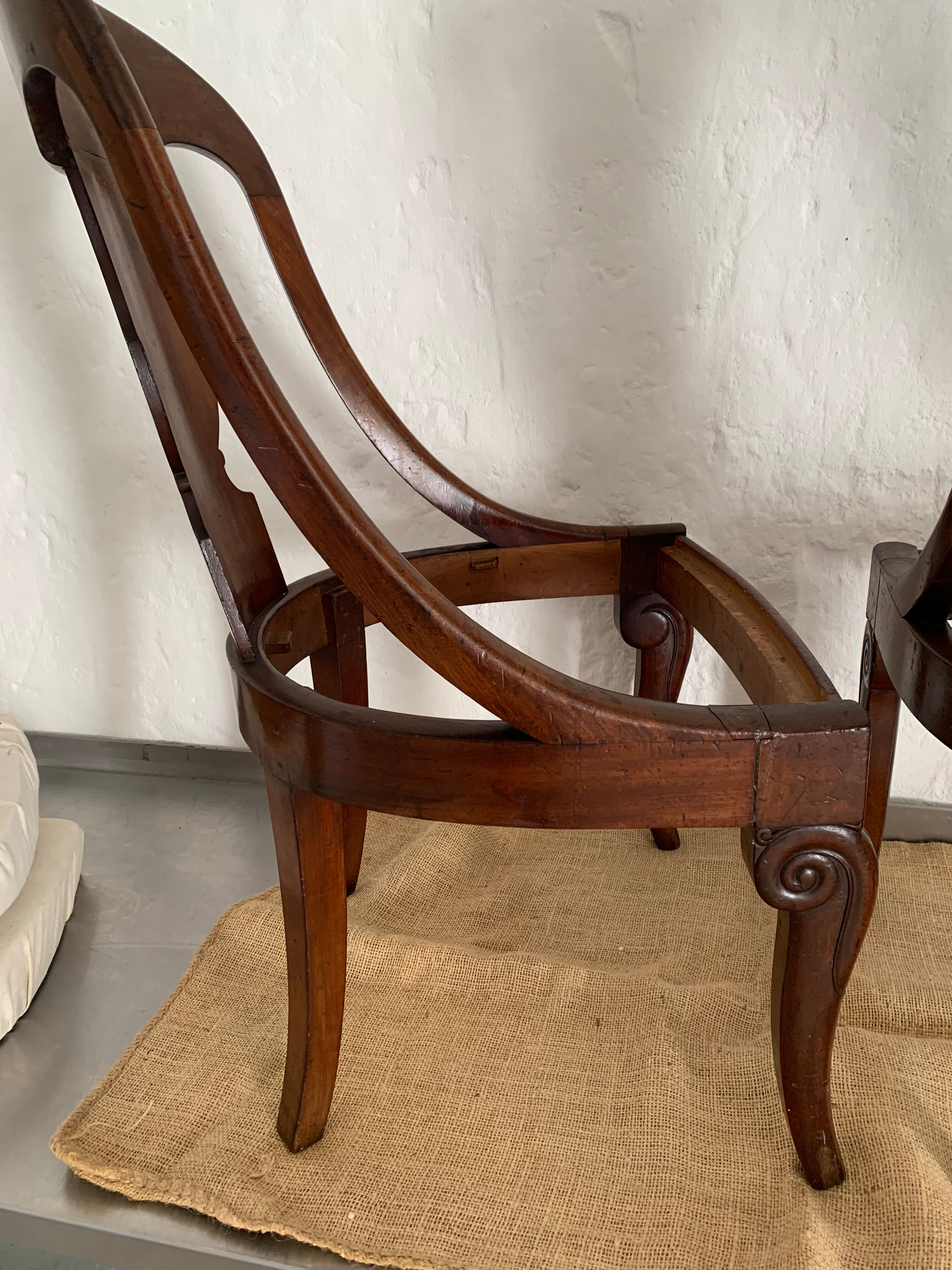 Two mahogany Empire Gondola chairs