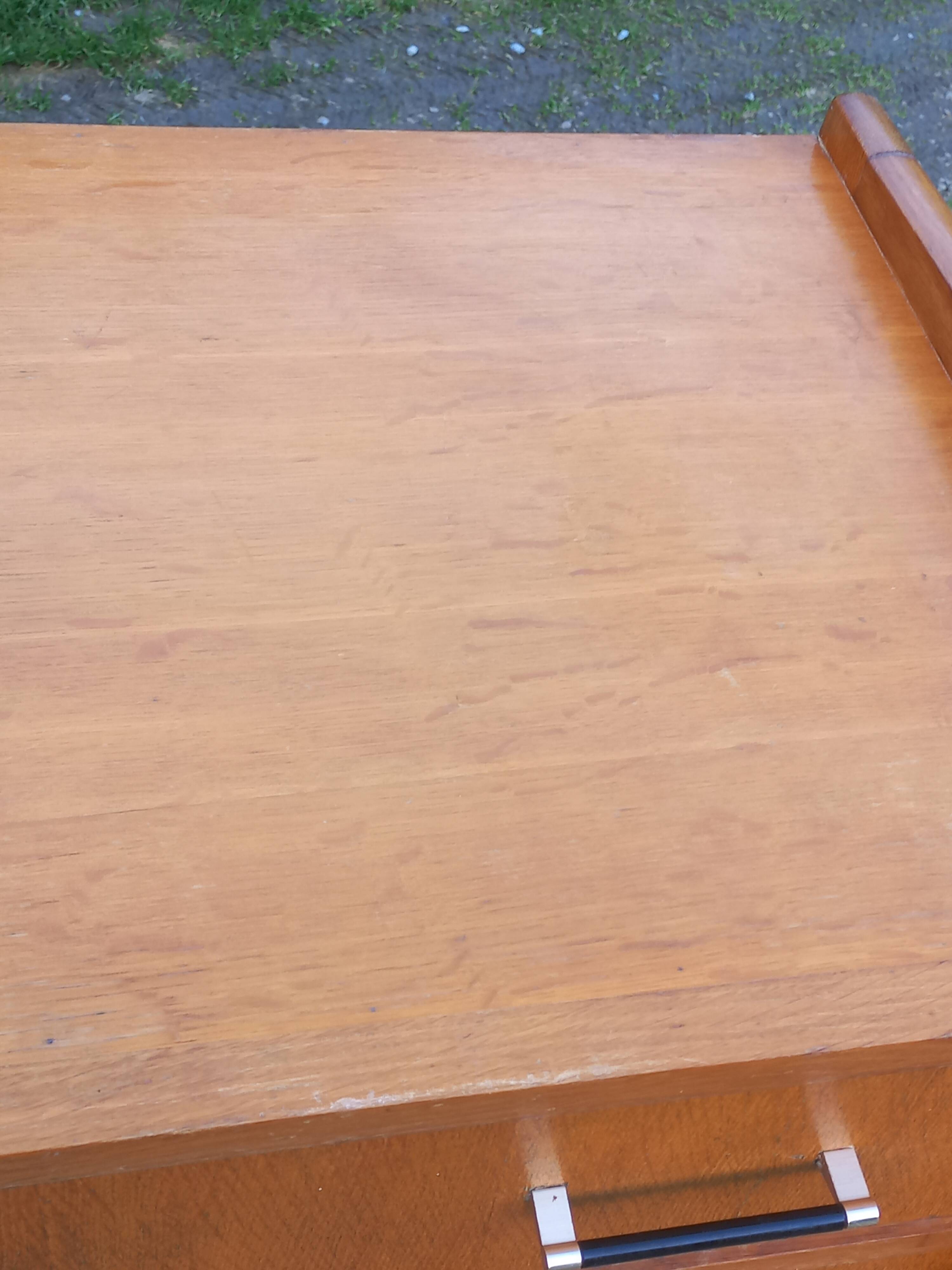 Vintage oak commode with tapered legs and wings from the 1950s.