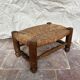 Rustic footrest made of wood and straw