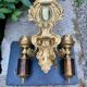 Wall light with 2 branches in baroque brass lion design.
