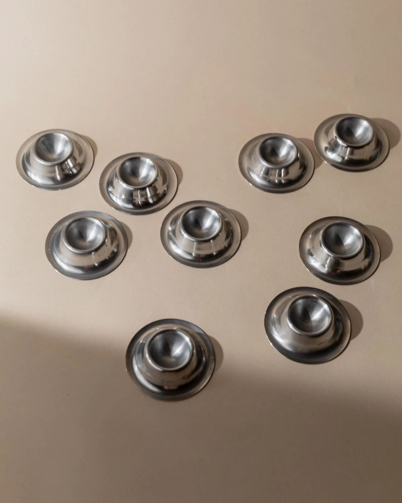 Lot of 9 vintage stainless steel egg cups from the 1970s, timeless minimalist design, dishwasher safe.