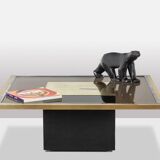 Table basse en laiton doré et verre fumé. Années 1970.
