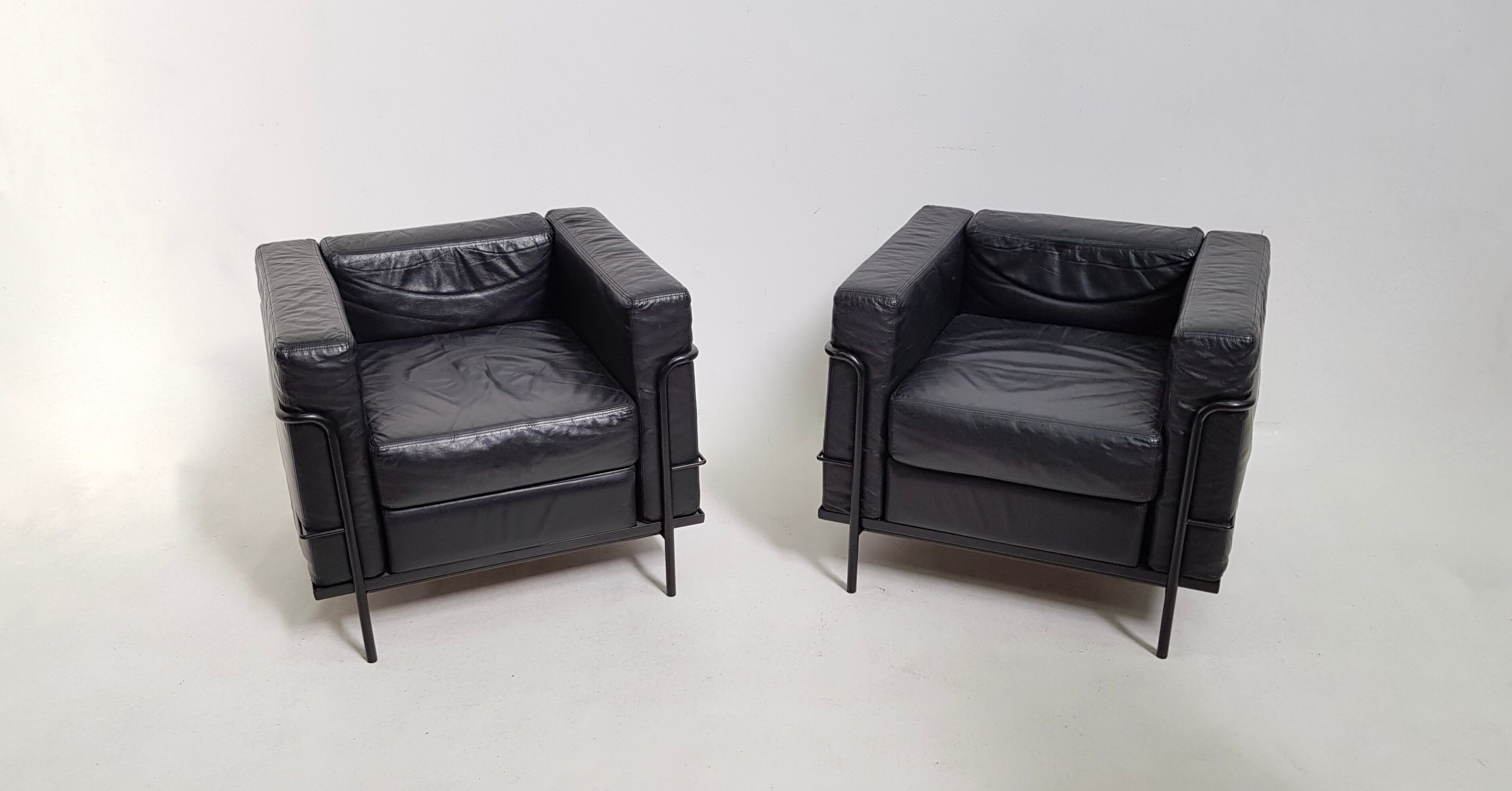Pair of vintage armchairs Hugues Chevalier in leather 1980