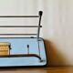 Vintage wall-mounted coat rack in wood and chrome metal with mirror