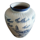 Large terracotta vase covered with ceramics