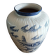 Large terracotta vase covered with ceramics
