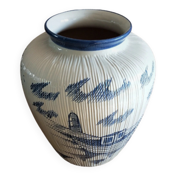 Large terracotta vase covered with ceramics
