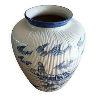 Large terracotta vase covered with ceramics