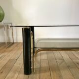 coffee table in smoked glass and black and gold metal from the 70s