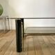 coffee table in smoked glass and black and gold metal from the 70s