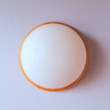 Wall light in pine and white opal.