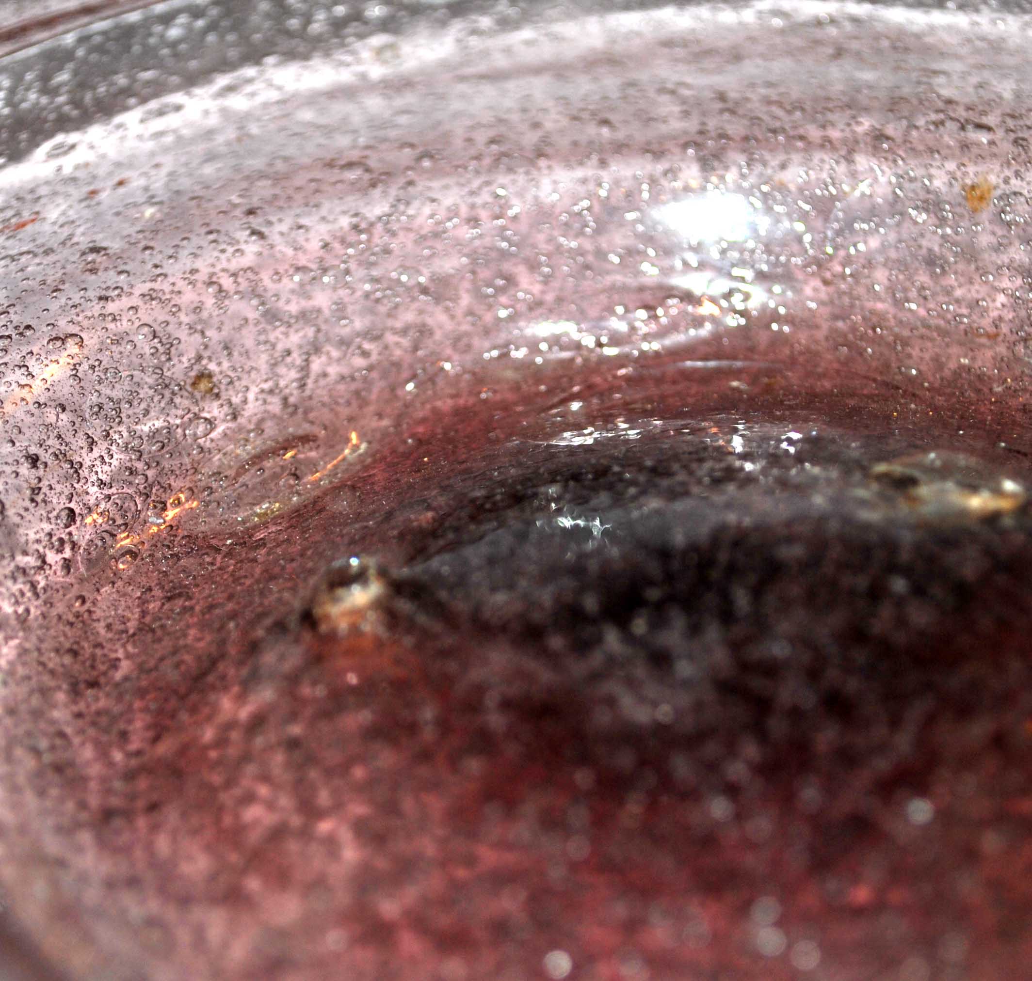 Antique plate in pink bubbled blown glass