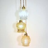 Cascade pendant light with 3 molded glass globes in vintage arabesque amber glass